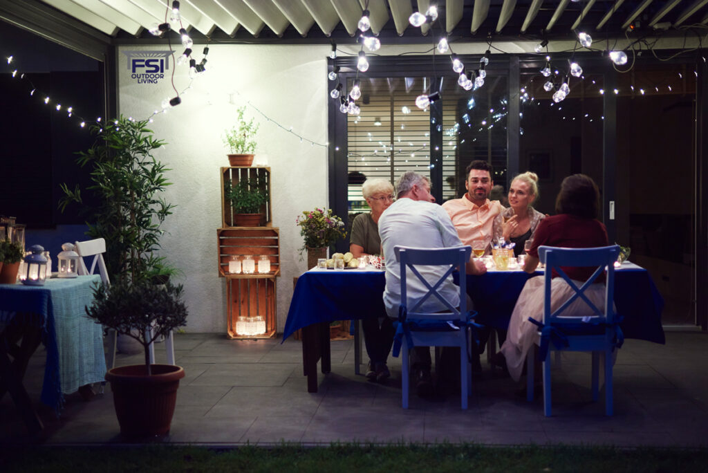 How Bellevue Families Are Creating All-Season Outdoor Spaces with Retractable Pergola Covers group of people sitting at table enjoying meal 2025 04 04 09 46 36 utc